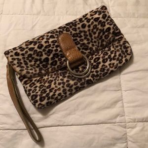 FIRM! Leopard faux fur clutch 🐆